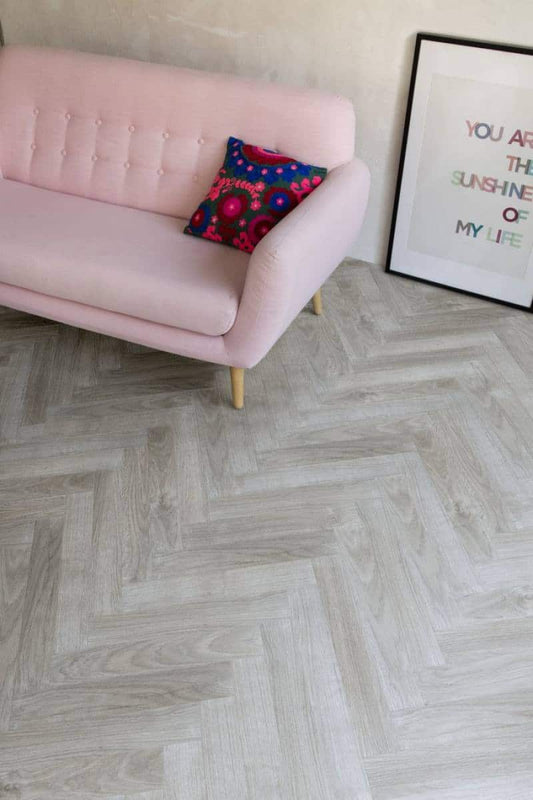 BerryAlloc ® Chateau Java Light Grey Herringbone Laminate Flooring