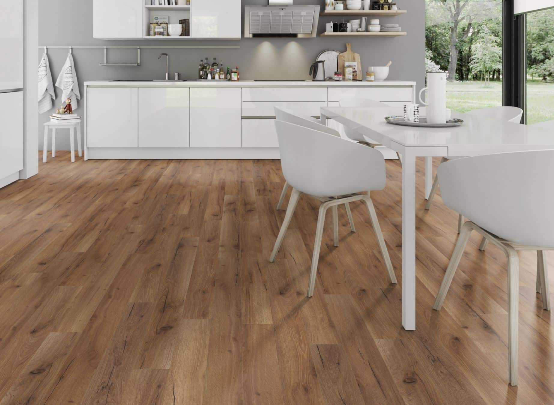 A modern kitchen featuring elegant wood floors and stylish white furniture, creating a bright and inviting atmosphere.